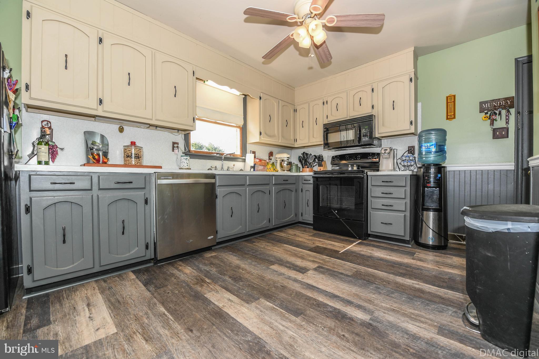 13230 Independence Road Clear Spring, MD 21722 - Photo 7 of 30 a kitchen with stainless steel appliances granite countertop a stove sink and cabinets