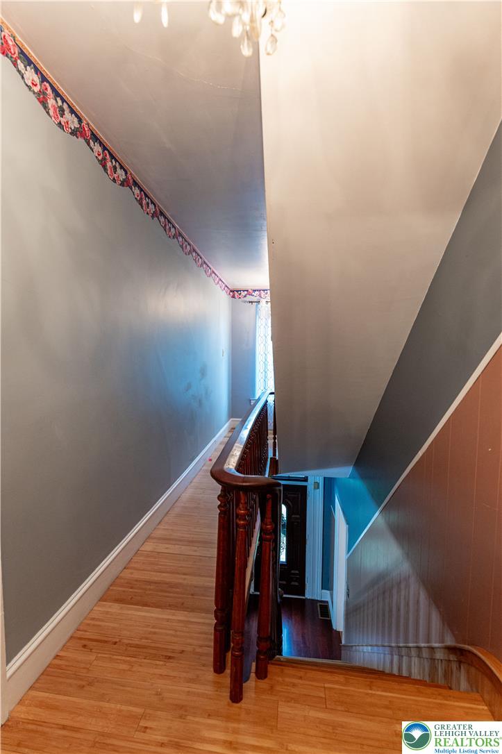 2485 Hieter Road Quakertown, PA 18951 - Photo 26 of 97 Step into a charming entryway featuring warm hardwood flooring and a classic wooden banister.