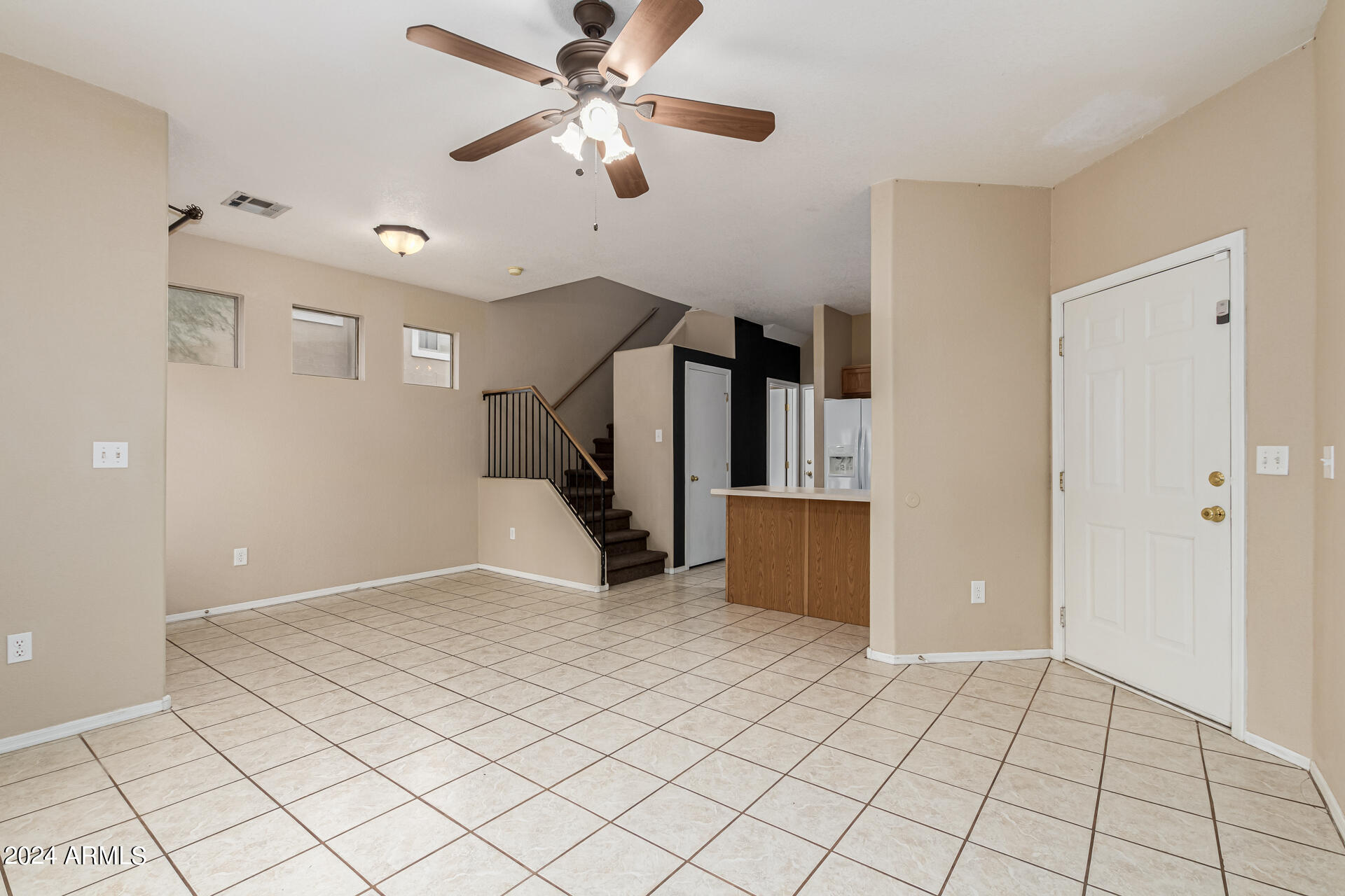 1371 South Boulder Street, Unit A Gilbert, AZ 85296 - Photo 8 of 43 a view of a livingroom with a ceiling fan