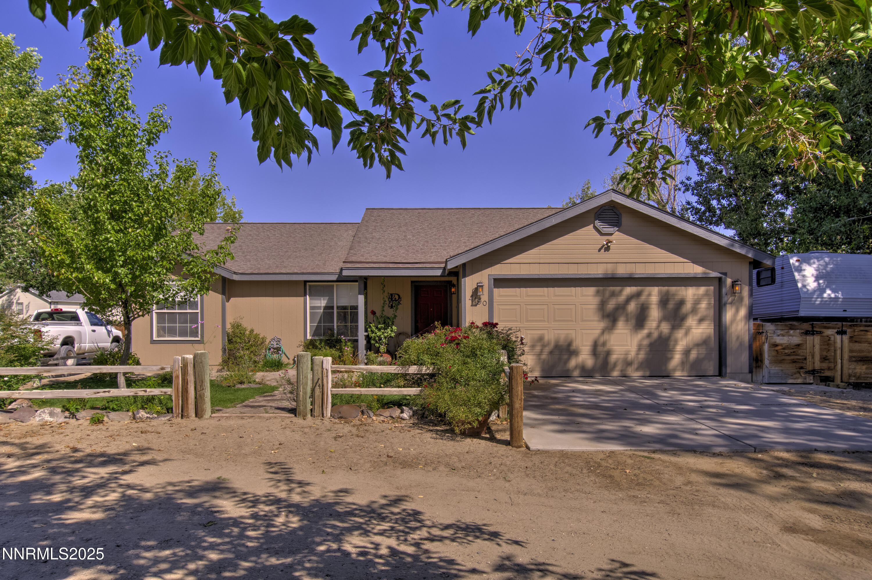4190 Bottom Road Fallon, NV 89406 - Photo 1 of 44 a front view of a house with garden