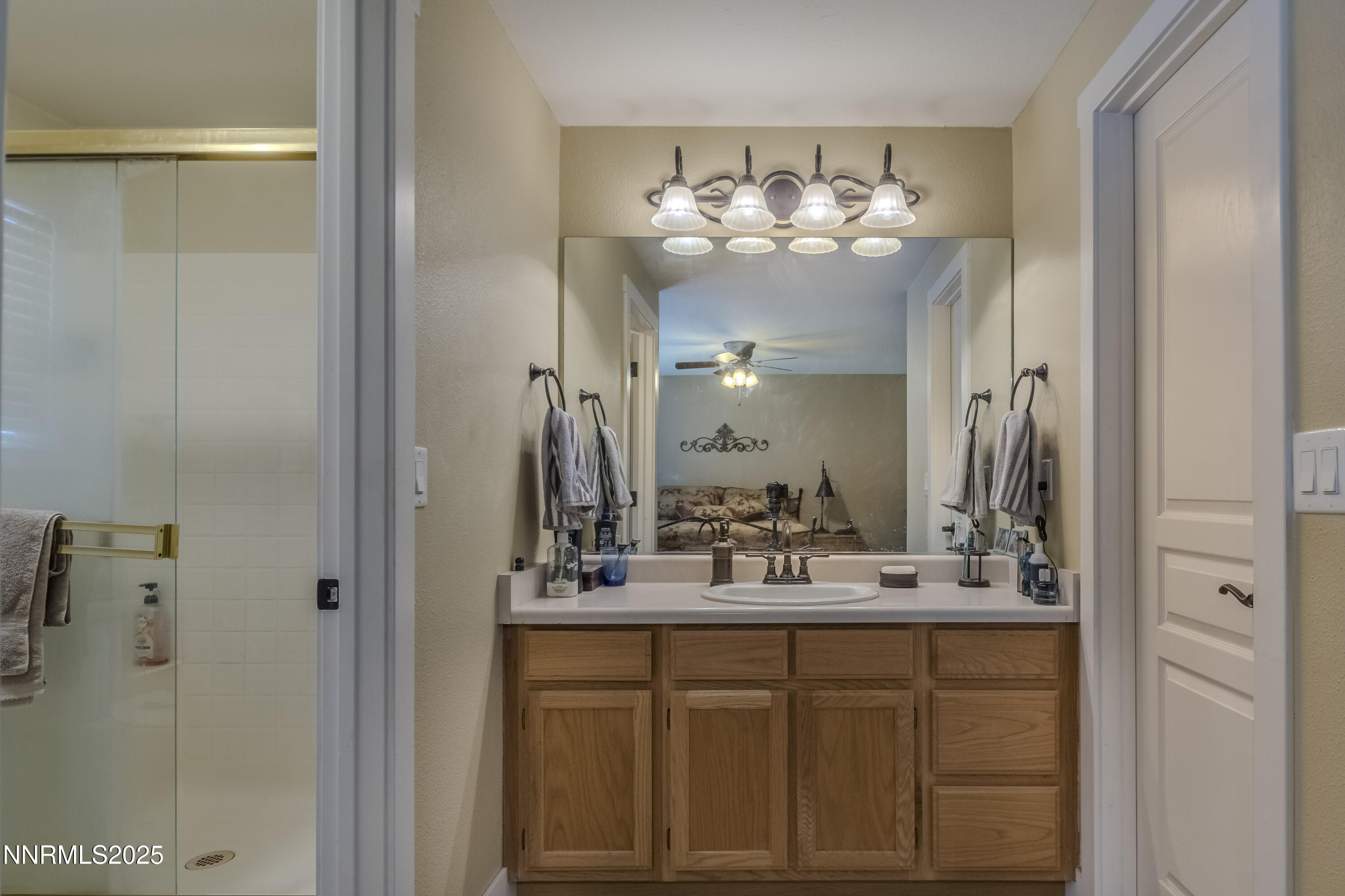 4190 Bottom Road Fallon, NV 89406 - Photo 18 of 44 a bathroom with a sink shower and a mirror
