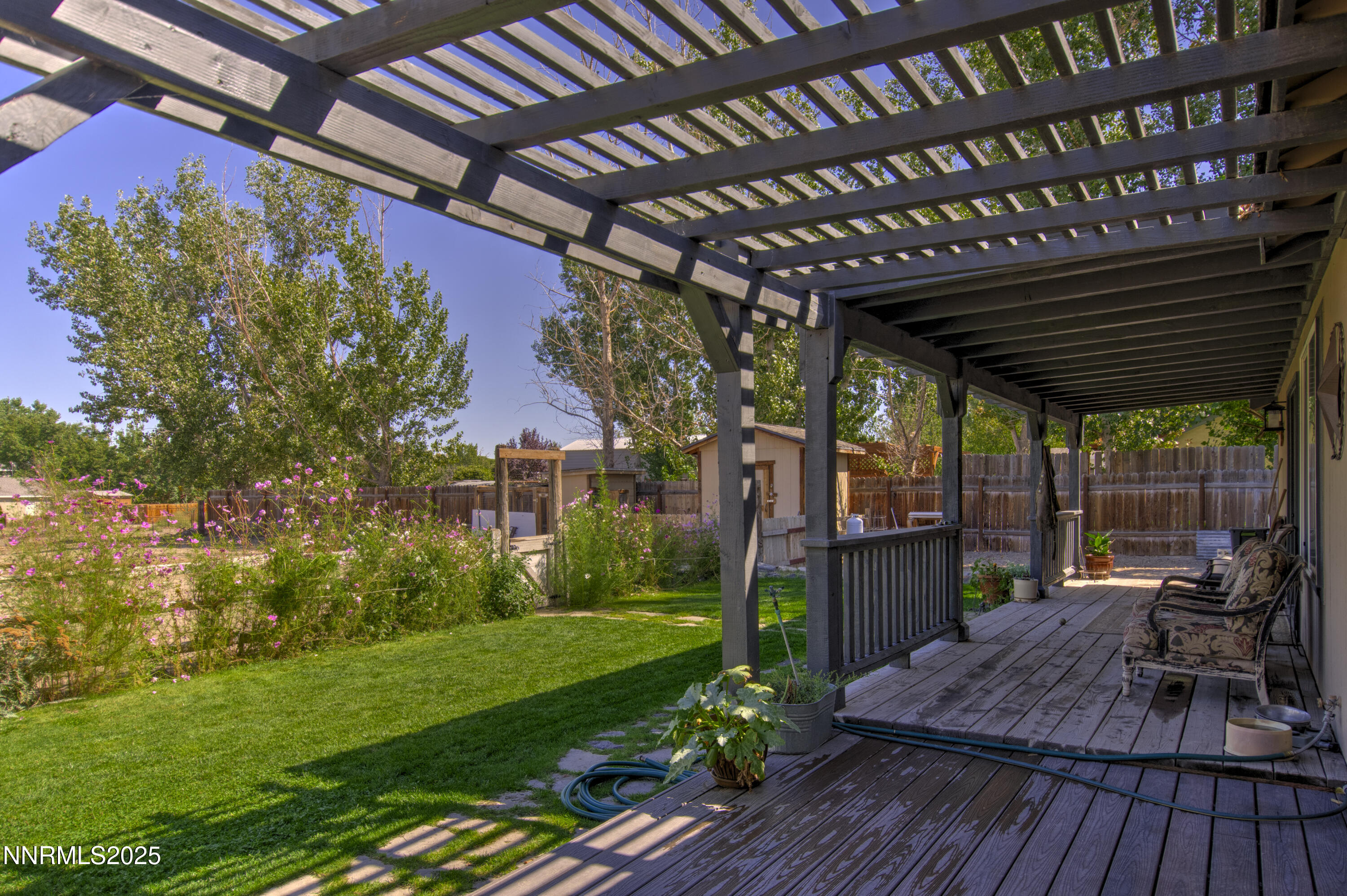4190 Bottom Road Fallon, NV 89406 - Photo 20 of 44 a view of a porch with furniture and a yard