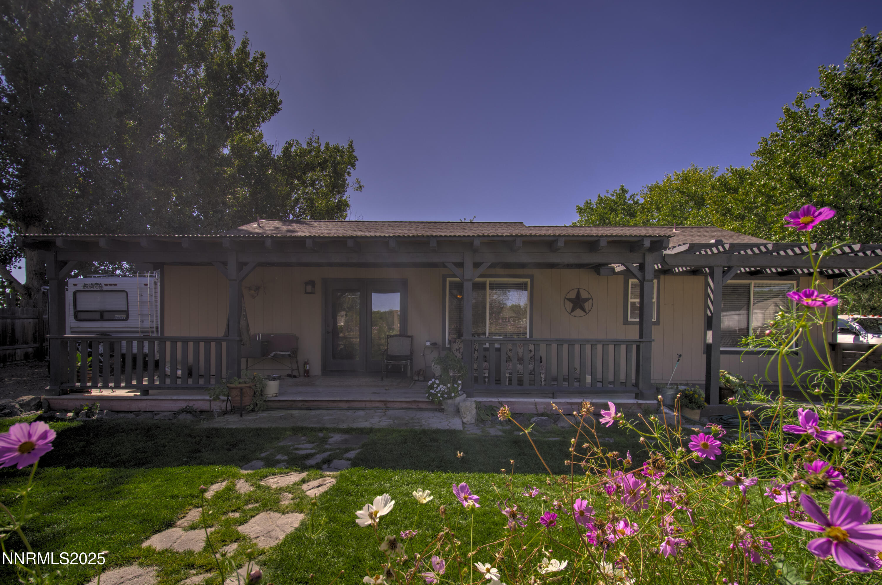 4190 Bottom Road Fallon, NV 89406 - Photo 22 of 44 a front view of a house with a yard and fountain