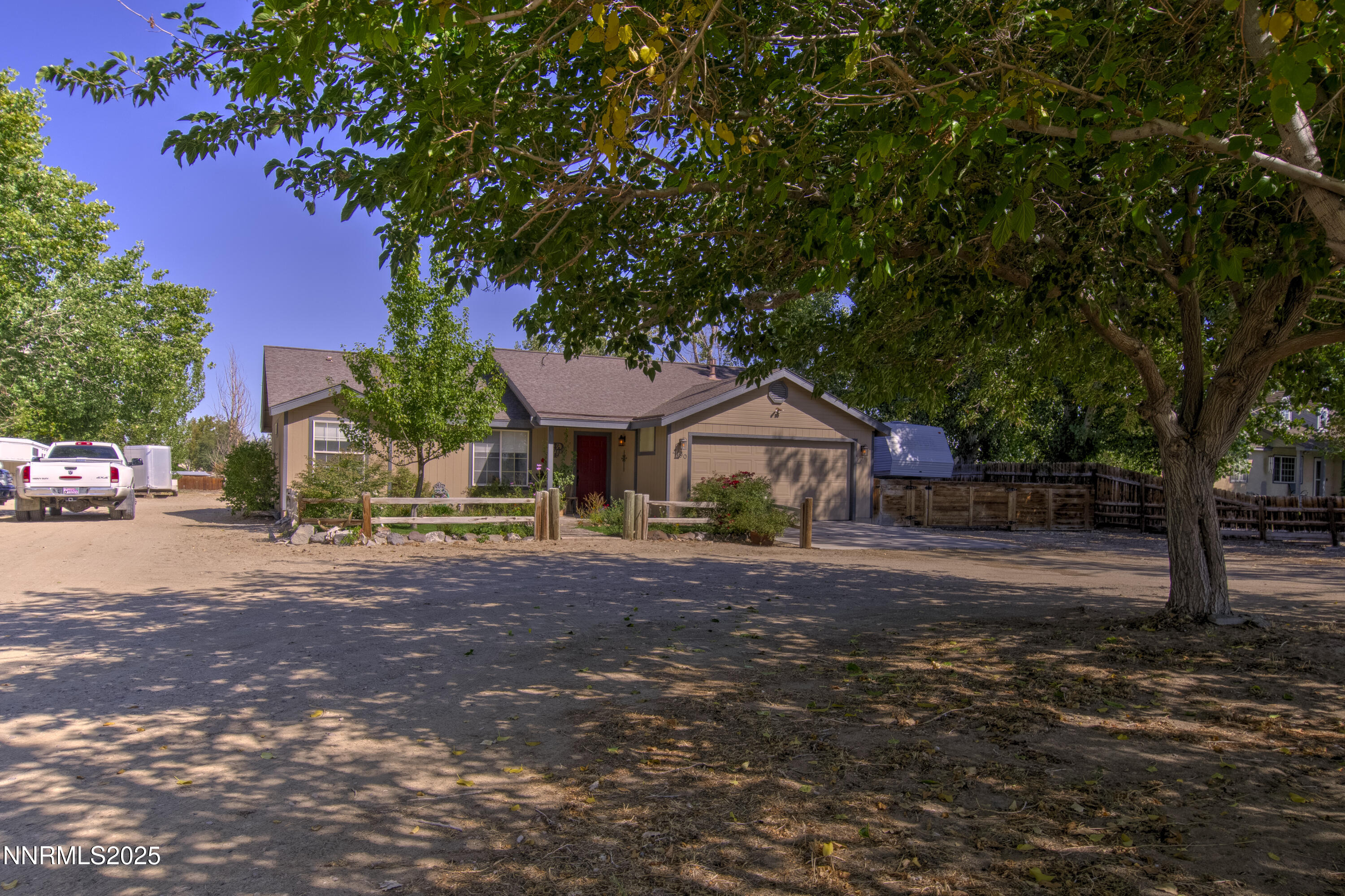 4190 Bottom Road Fallon, NV 89406 - Photo 41 of 44 a front view of a house with a yard and garage