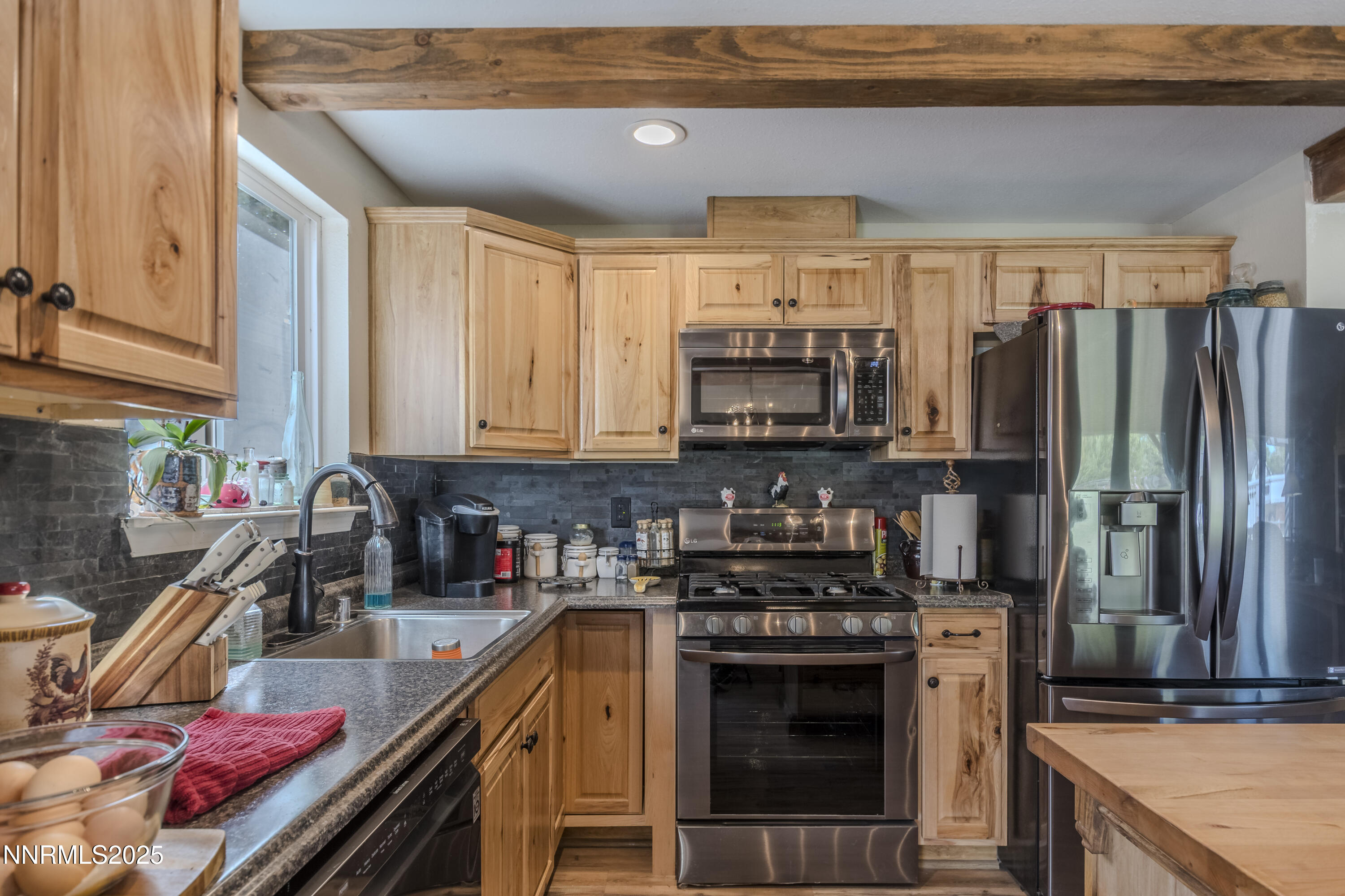 4190 Bottom Road Fallon, NV 89406 - Photo 7 of 44 a kitchen with kitchen island granite countertop a sink stove and refrigerator