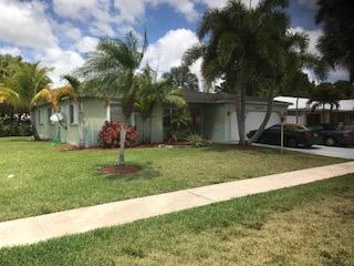 10907 Gable Street Boca Raton, FL 33428 - Photo 2 of 40 a view of a backyard with a garden