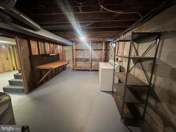 a room with a wooden floor and a window