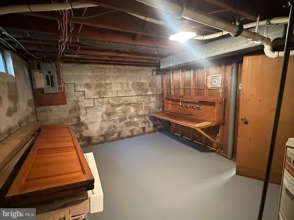 a view of room with air conditioner duct and materials on floor