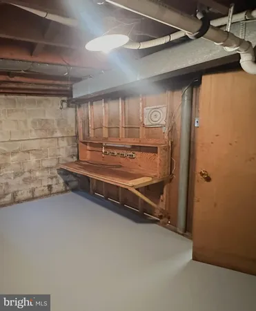 a view of an empty room with wooden walls