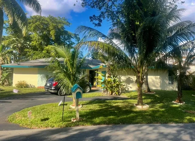 a view of a dining room with furniture and window