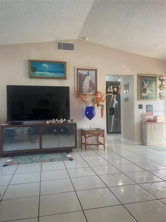 7551 Southwest 42nd Place Davie, FL 33314 - Photo 22 of 56 a living room with furniture and a flat screen tv
