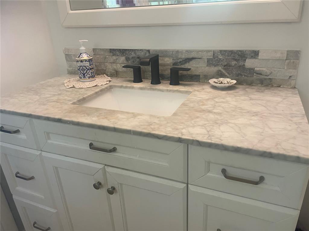 7551 Southwest 42nd Place Davie, FL 33314 - Photo 48 of 56 a kitchen with a sink and cabinets