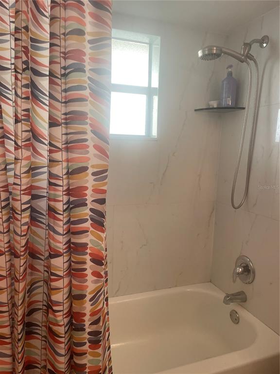 7551 Southwest 42nd Place Davie, FL 33314 - Photo 54 of 56 a bathroom with a bathtub and a shower