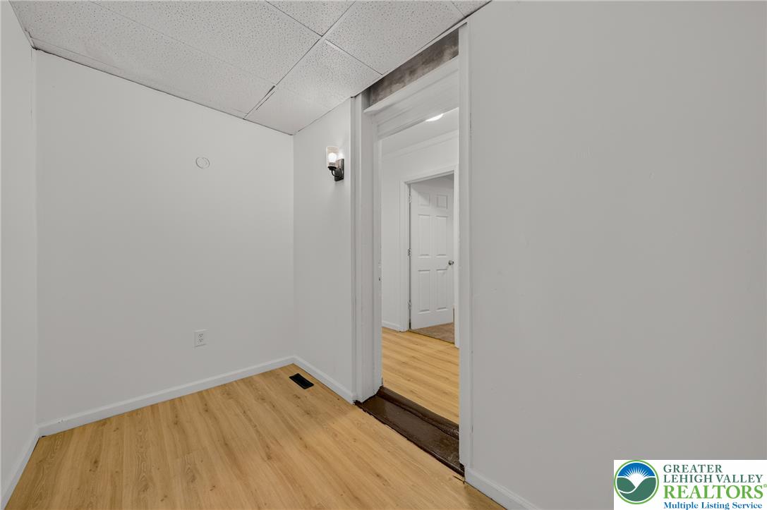 313 Main Street Slatington, PA 18080 - Photo 9 of 73 A well-lit interior space features sleek wood flooring, ready for your personalized touch.