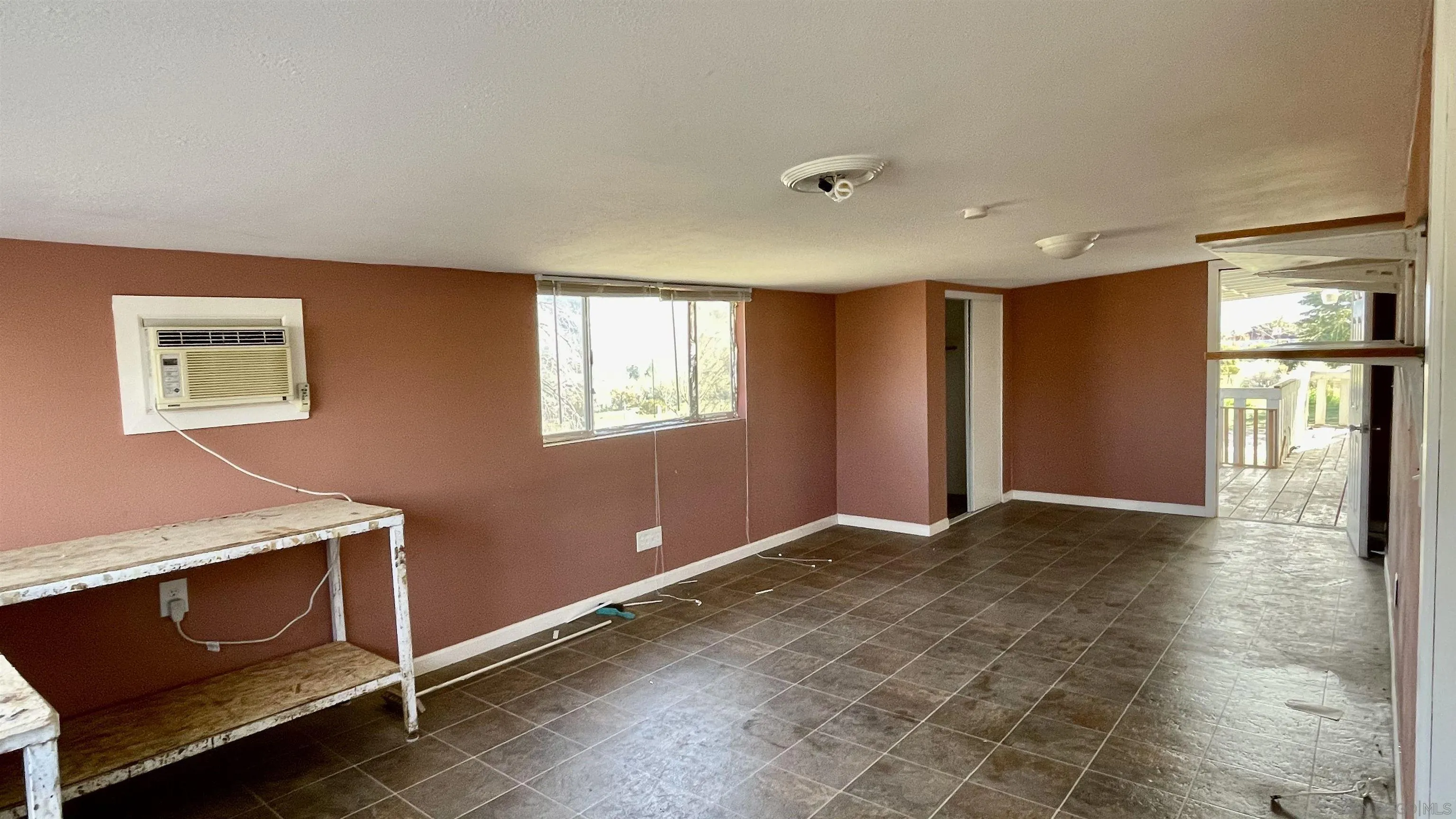764 Surrey Trail Julian, CA 92036 - Photo 13 of 15 a view of an empty room with window and wooden floor