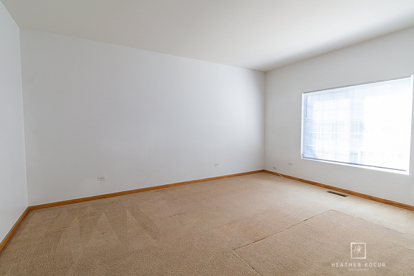 146 Enclave Circle, Unit D Bolingbrook, IL 60440 - Photo 11 of 33 an empty room with a window