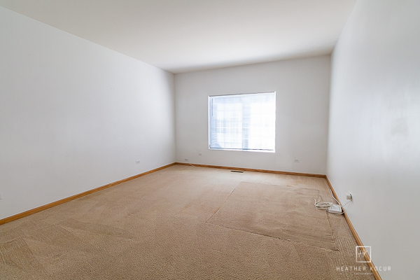 146 Enclave Circle, Unit D Bolingbrook, IL 60440 - Photo 12 of 33 an empty room with windows