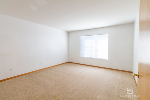146 Enclave Circle, Unit D Bolingbrook, IL 60440 - Photo 16 of 33 an empty room with a window