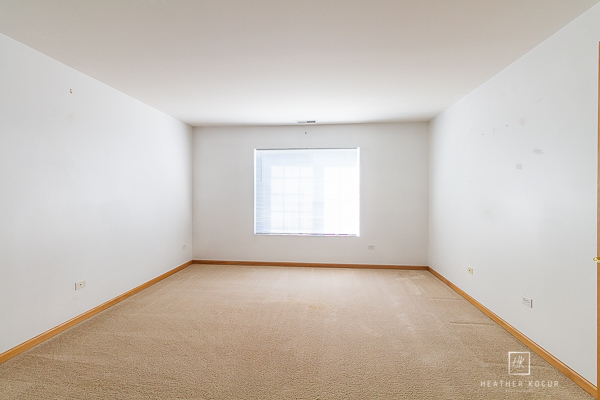 146 Enclave Circle, Unit D Bolingbrook, IL 60440 - Photo 17 of 33 an empty room with a window