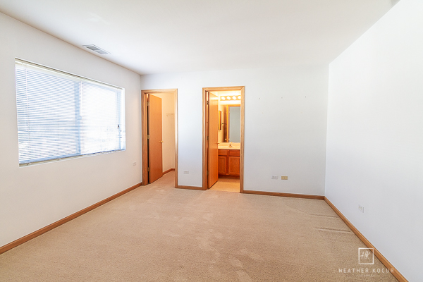 146 Enclave Circle, Unit D Bolingbrook, IL 60440 - Photo 21 of 33 an empty room with windows