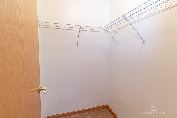 146 Enclave Circle, Unit D Bolingbrook, IL 60440 - Photo 23 of 33 a view of a room with racks on the wall