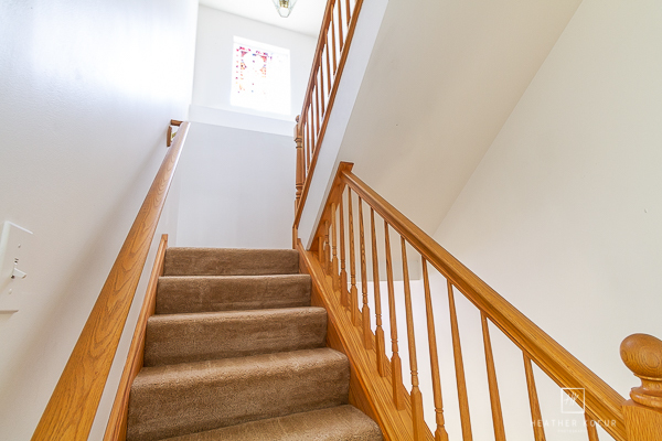 146 Enclave Circle, Unit D Bolingbrook, IL 60440 - Photo 25 of 33 a view of staircase with railing and white walls