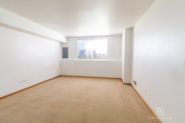 146 Enclave Circle, Unit D Bolingbrook, IL 60440 - Photo 28 of 33 an empty room with a window