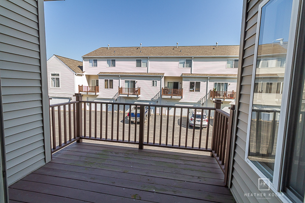146 Enclave Circle, Unit D Bolingbrook, IL 60440 - Photo 30 of 33 a view of a building from a balcony