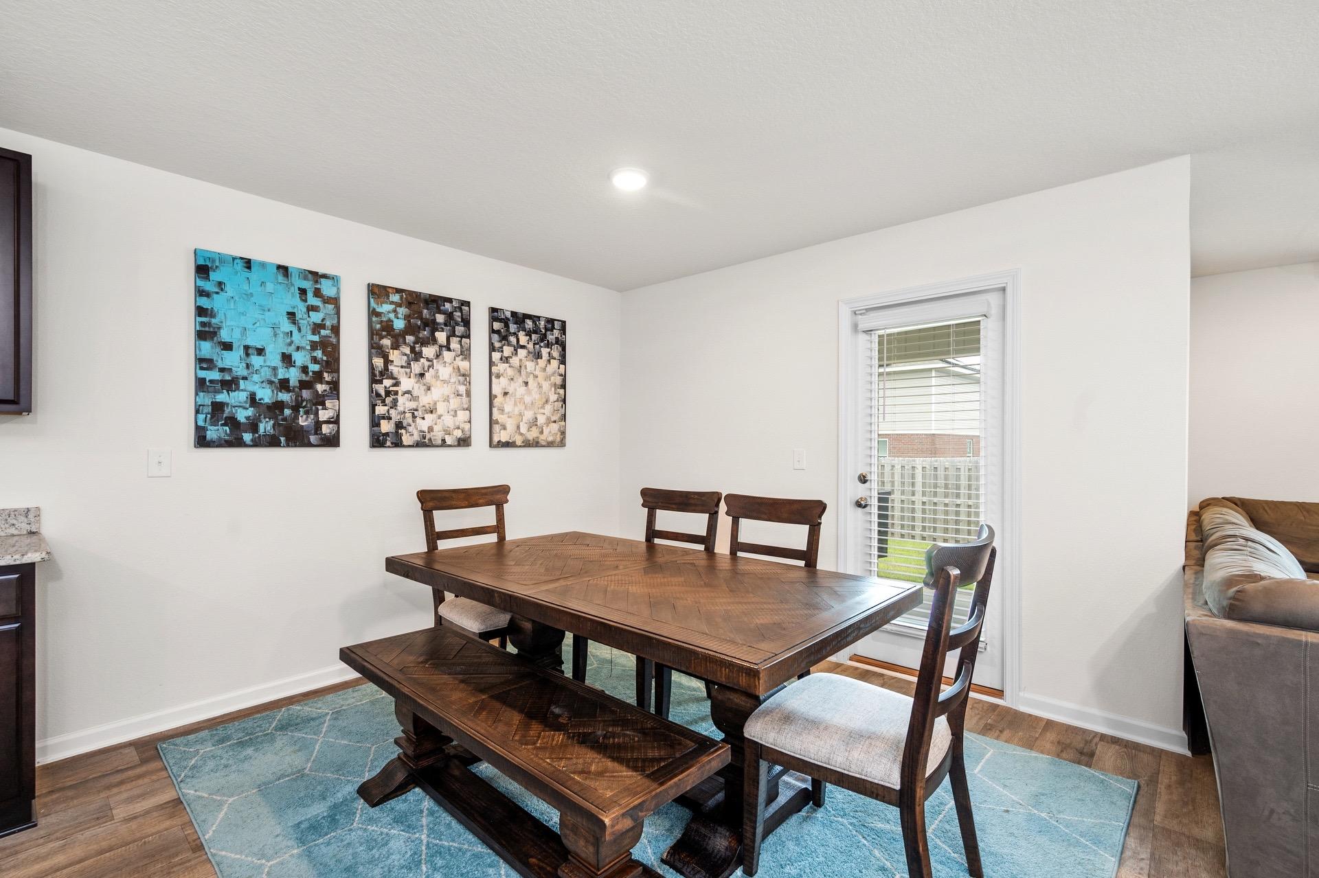 816 Moorhen Way Crestview, FL 32539 - Photo 13 of 22 a dining room with furniture and wooden floor