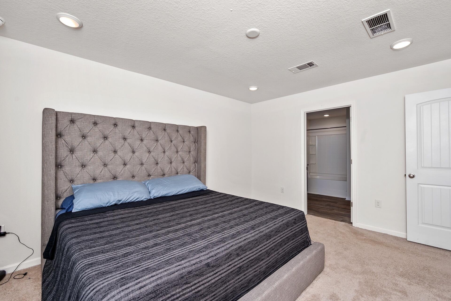 816 Moorhen Way Crestview, FL 32539 - Photo 16 of 22 a bedroom with a bed and a wall painting