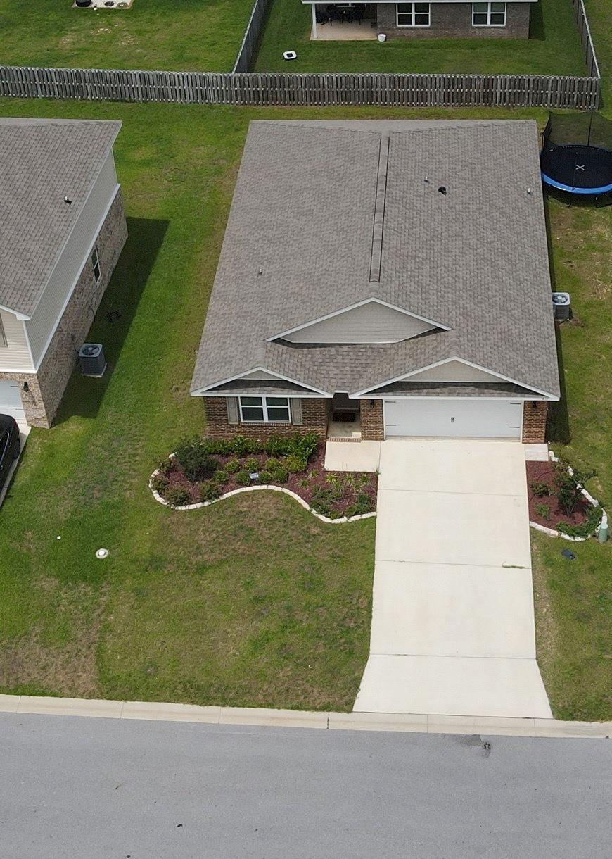 816 Moorhen Way Crestview, FL 32539 - Photo 6 of 22 an aerial view of a house with a yard basket ball court and outdoor seating