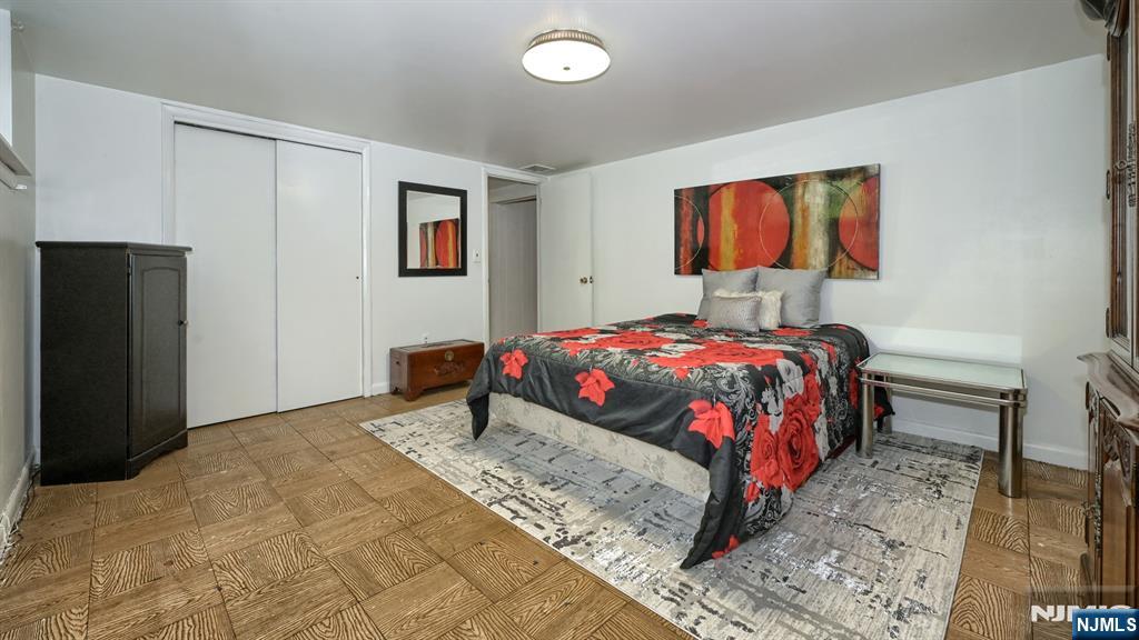 277 French Hill Road Wayne, NJ 07470 - Photo 22 of 28 a bedroom with a bed and a painting on the wall