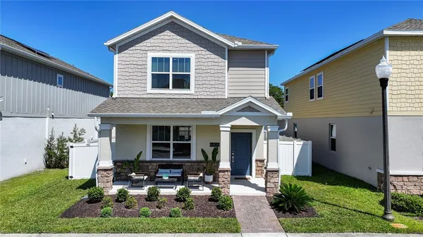 a front view of house with yard and green space