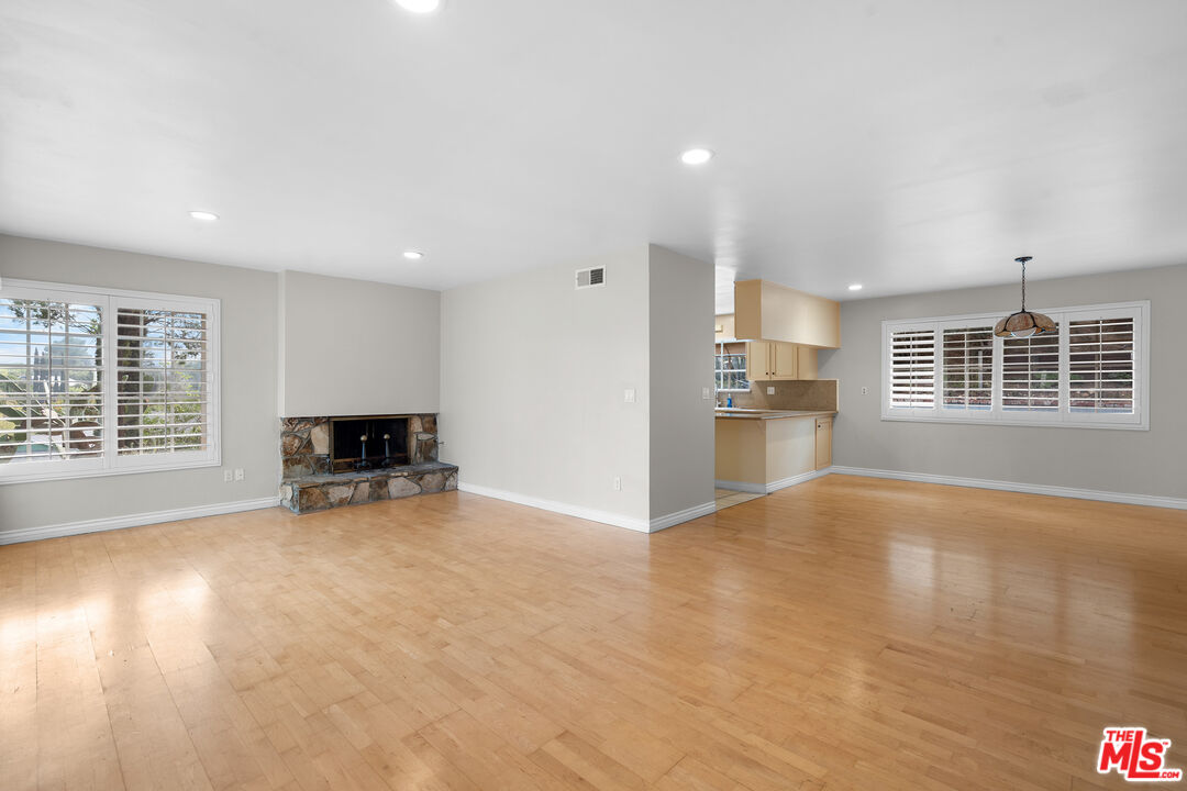 9631 Crystal View Drive Tujunga, CA 91042 - Photo 18 of 37 a view of an empty room with a window and wooden floor