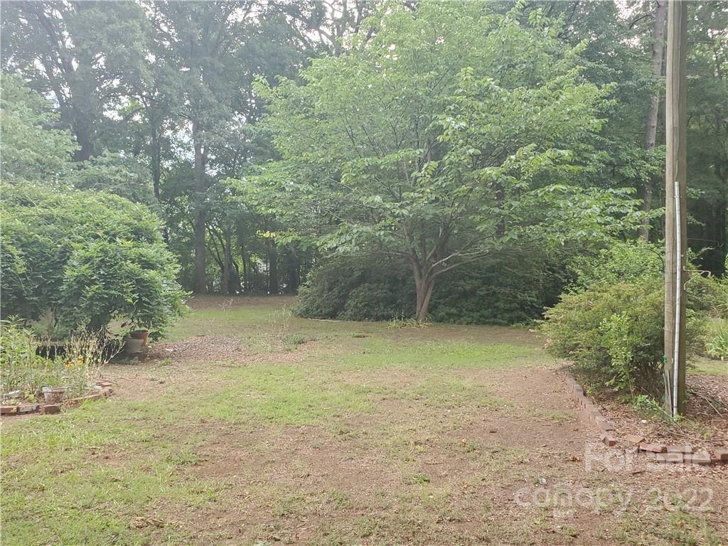 4401 Poplar Tent Road Concord, NC 28027 - Photo 15 of 16 a view of a yard with trees