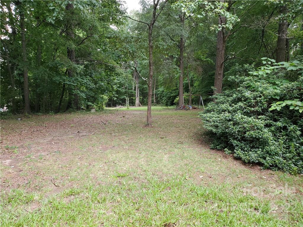 4401 Poplar Tent Road Concord, NC 28027 - Photo 16 of 16 a view of backyard with green space