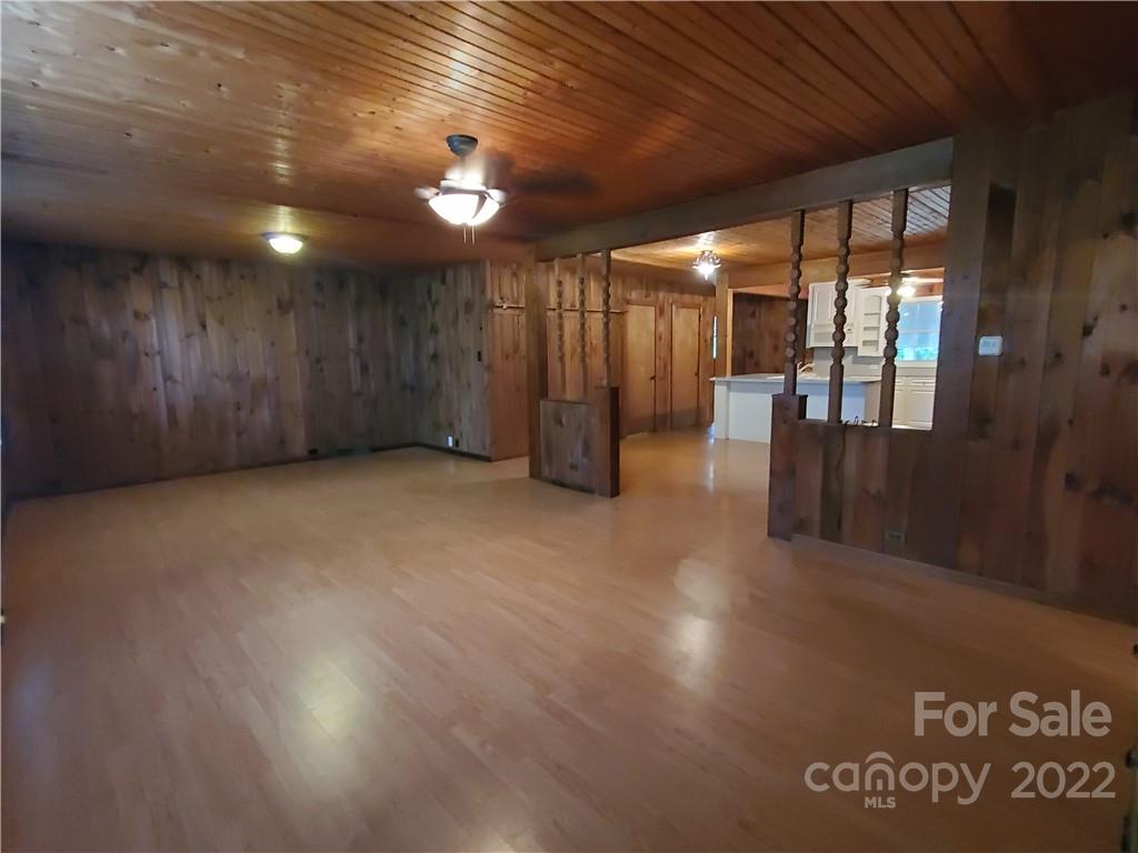 4401 Poplar Tent Road Concord, NC 28027 - Photo 2 of 16 a view of a hall with wooden floor