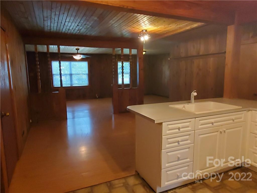 4401 Poplar Tent Road Concord, NC 28027 - Photo 6 of 16 a bathroom with a sink a vanity and mirror