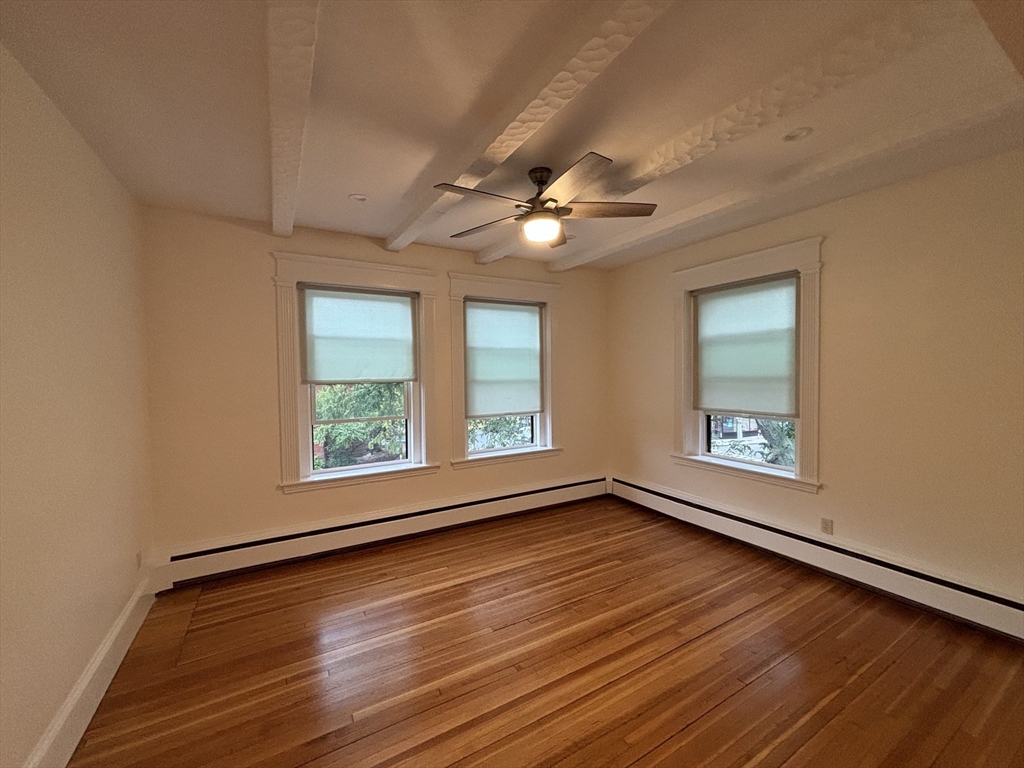 503 Park Drive, Unit 6 Boston, MA 02215 - Photo 2 of 9 a view of an empty room with a window and wooden floor