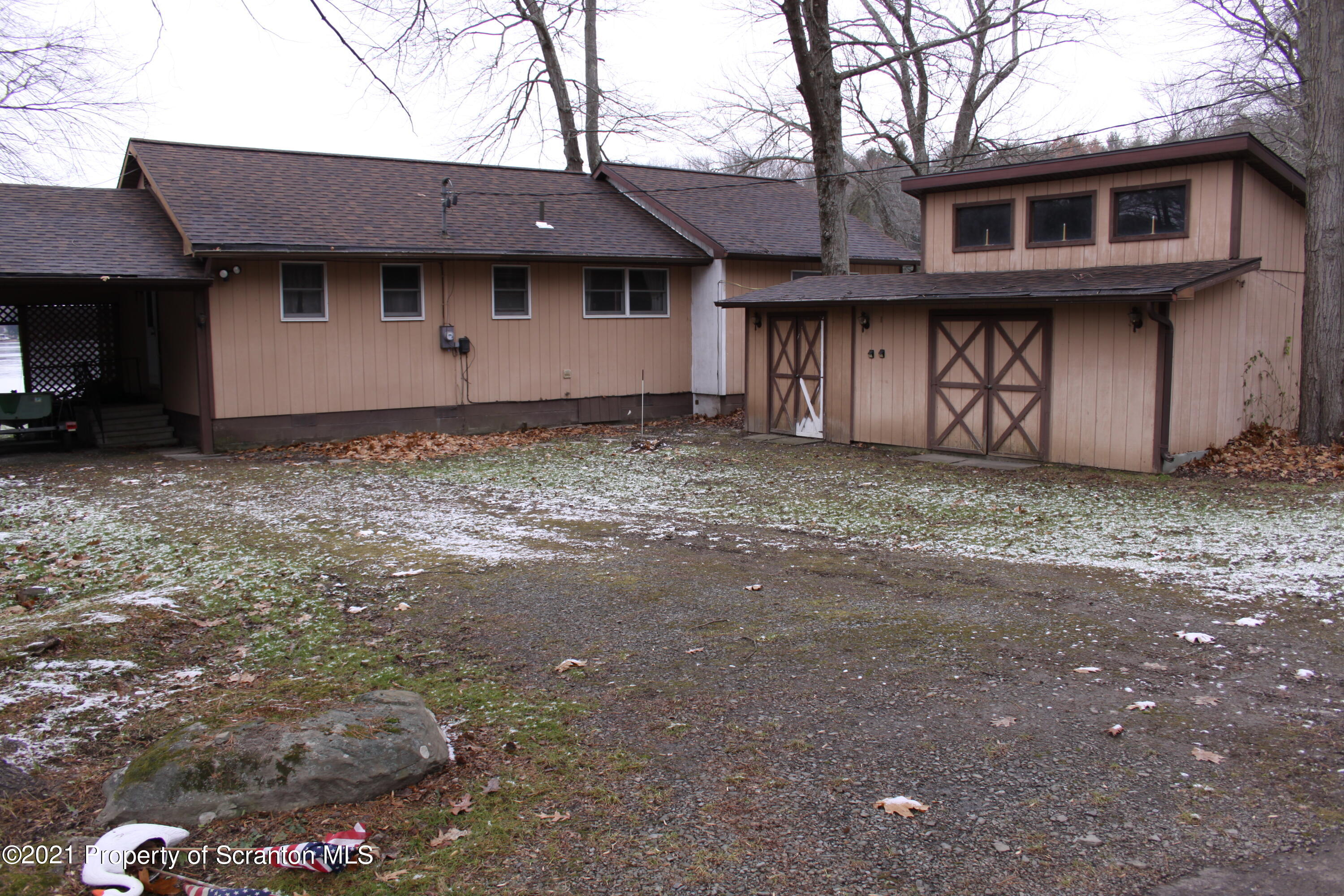 46 Cove Road Tunkhannock, PA 18657 - Photo 1 of 20 a view of a house with a window and wooden fence