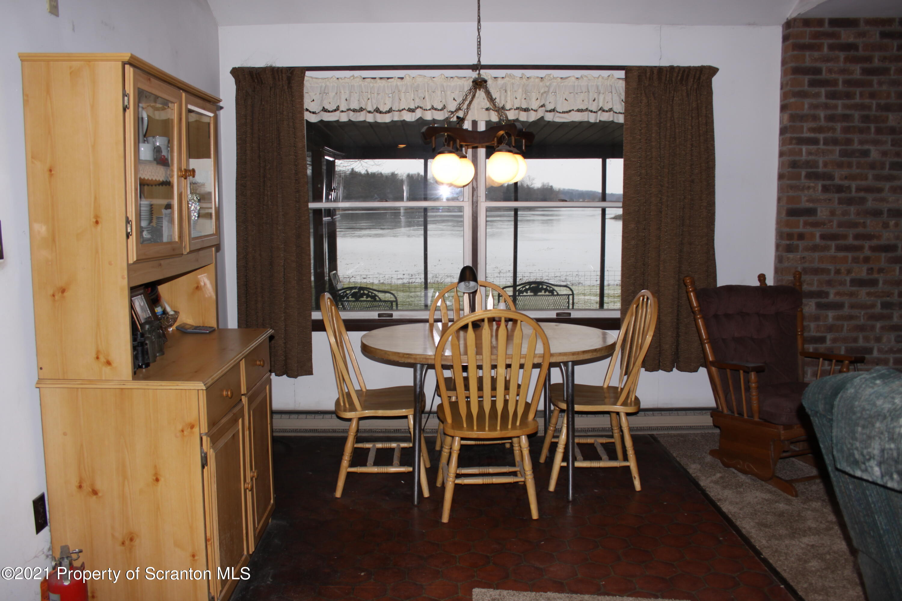 46 Cove Road Tunkhannock, PA 18657 - Photo 12 of 20 a dining room with furniture and window