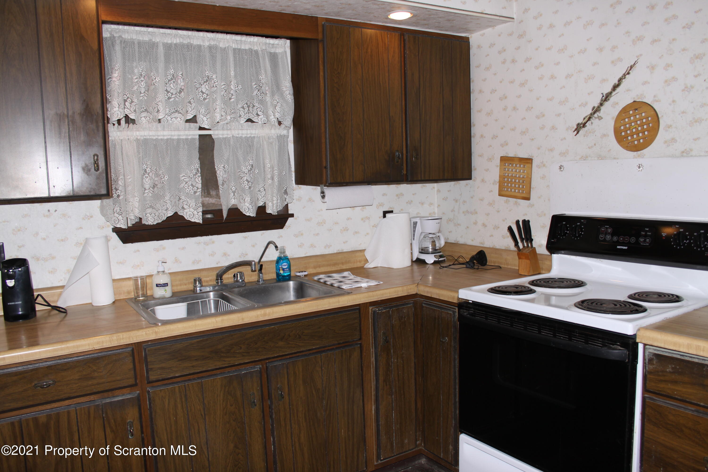 46 Cove Road Tunkhannock, PA 18657 - Photo 14 of 20 a kitchen with a sink and cabinets