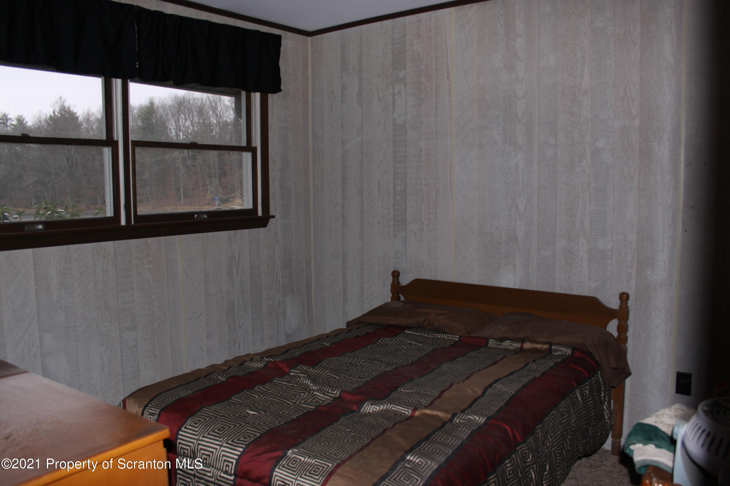 46 Cove Road Tunkhannock, PA 18657 - Photo 15 of 20 a bedroom with a bed and window