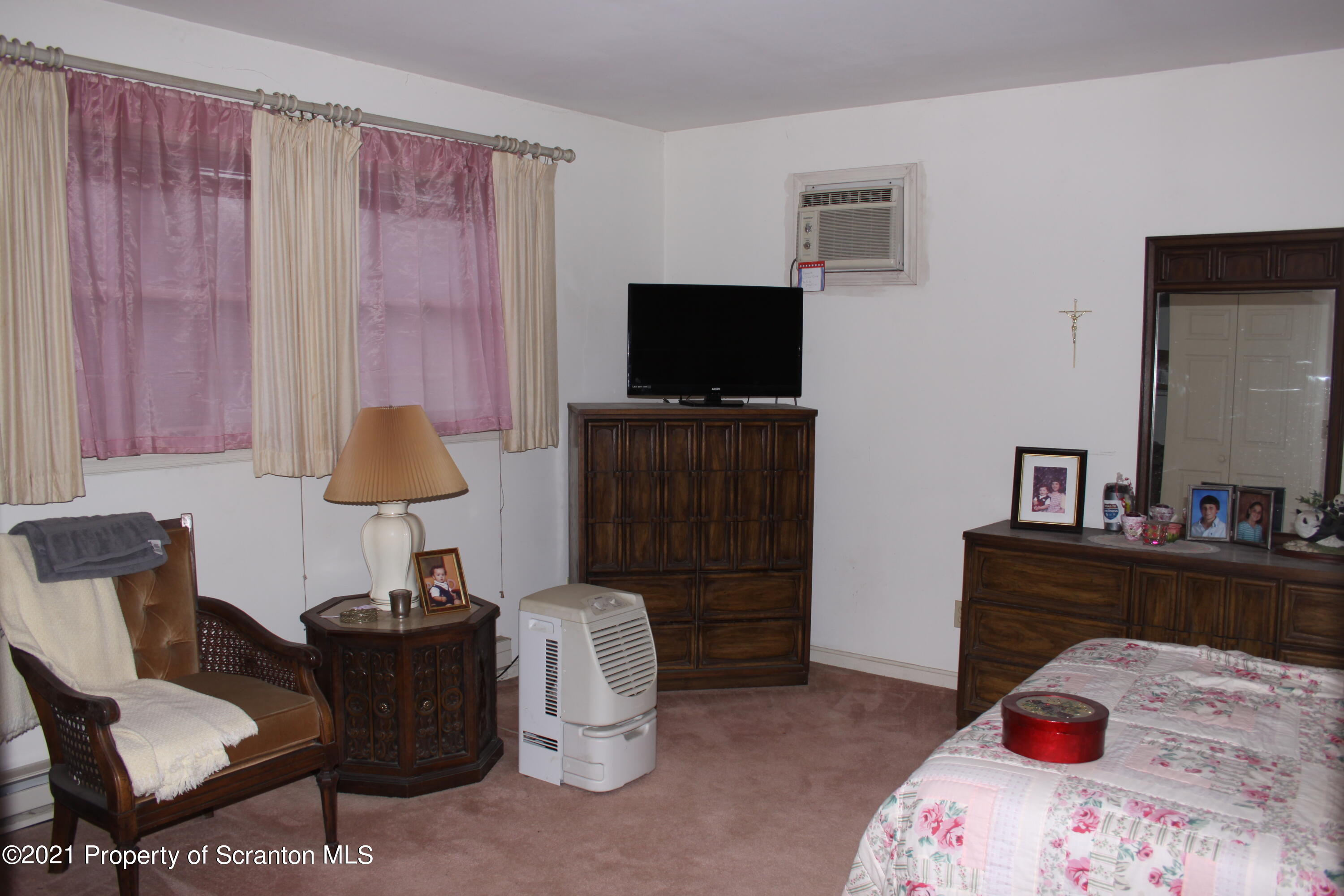 46 Cove Road Tunkhannock, PA 18657 - Photo 17 of 20 a bedroom with a bed and a television