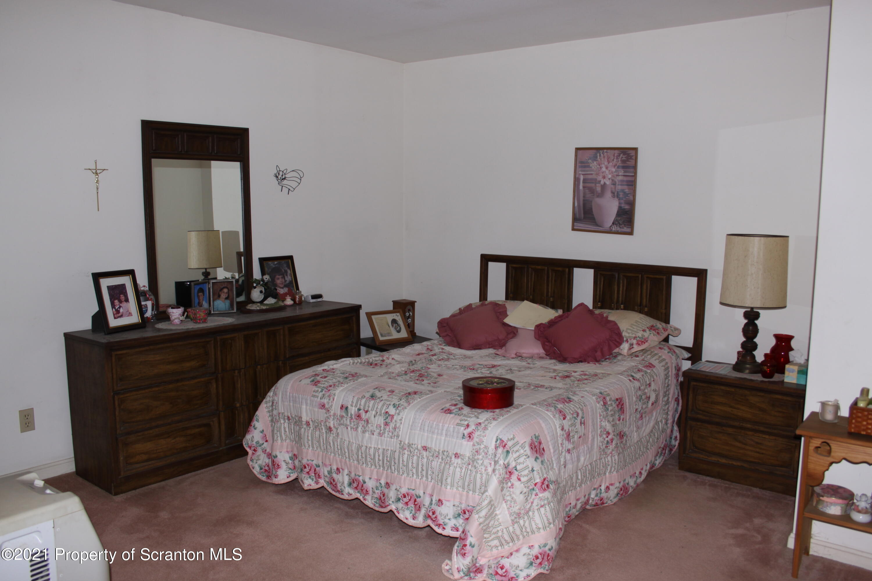 46 Cove Road Tunkhannock, PA 18657 - Photo 18 of 20 a bedroom with a bed and a dresser