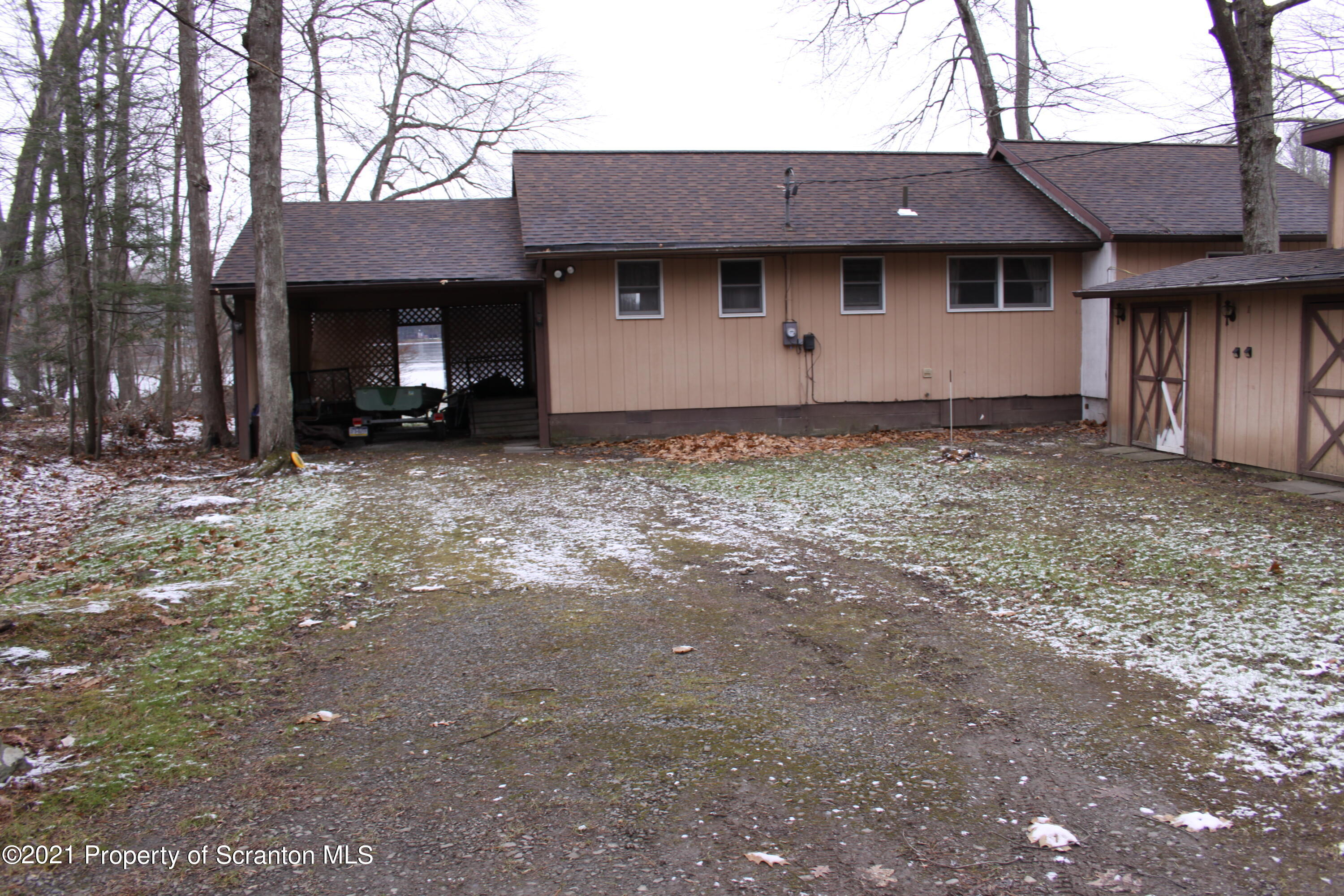 46 Cove Road Tunkhannock, PA 18657 - Photo 2 of 20 a view of a house with a yard and a tree