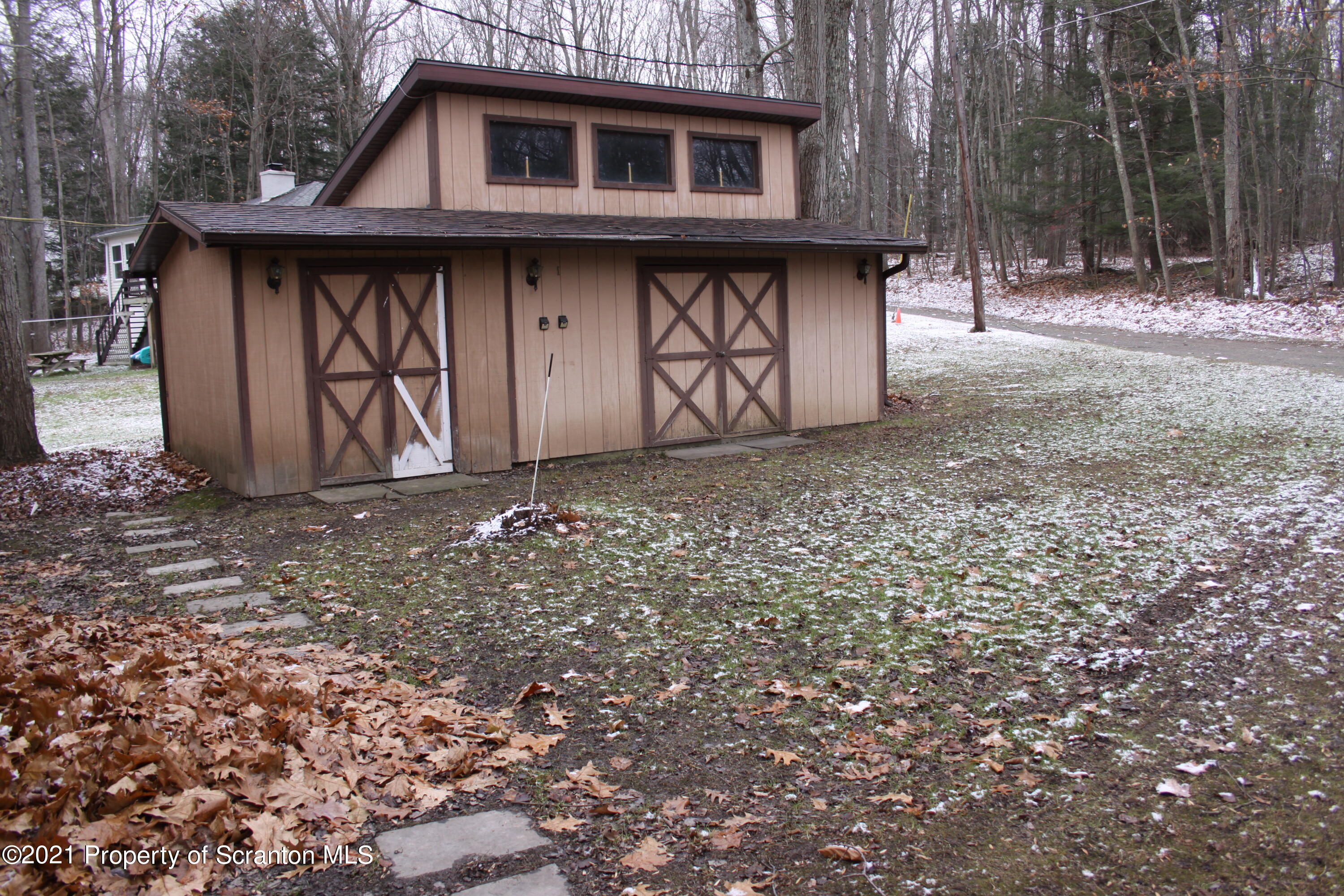 46 Cove Road Tunkhannock, PA 18657 - Photo 3 of 20 a front view of a house with garden