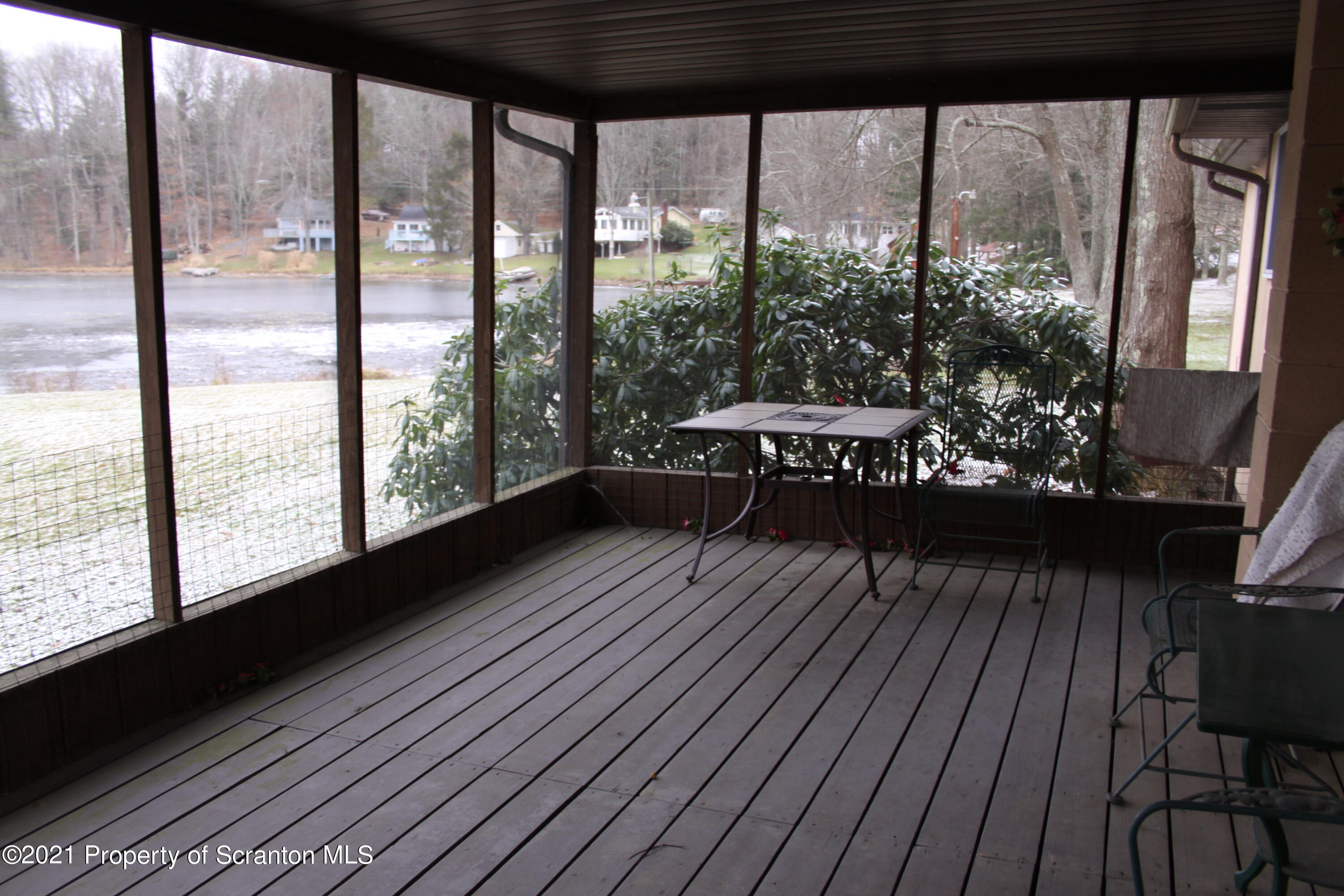 46 Cove Road Tunkhannock, PA 18657 - Photo 6 of 20 a view of a room with wooden floor and outdoor seating