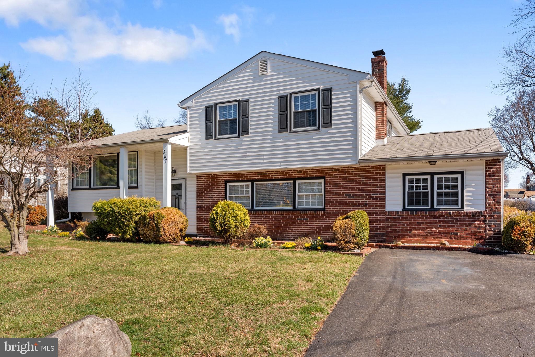 857 West County Line Road Warminster, PA 18974 - Photo 1 of 38 a front view of a house with a yard