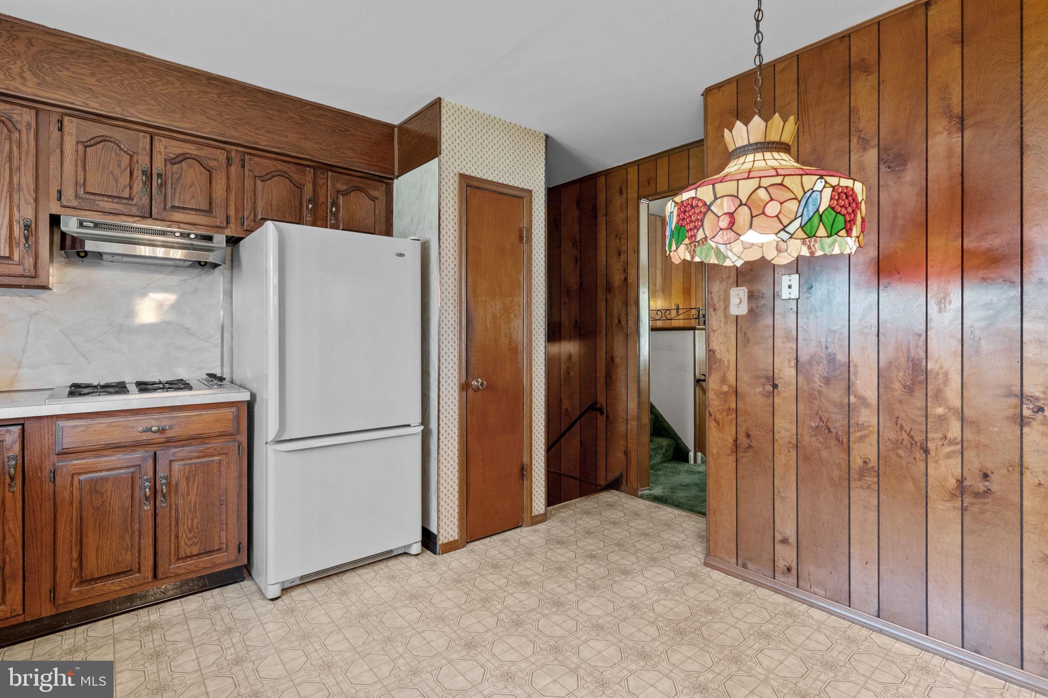 857 West County Line Road Warminster, PA 18974 - Photo 12 of 38 a kitchen with refrigerator and cabinets